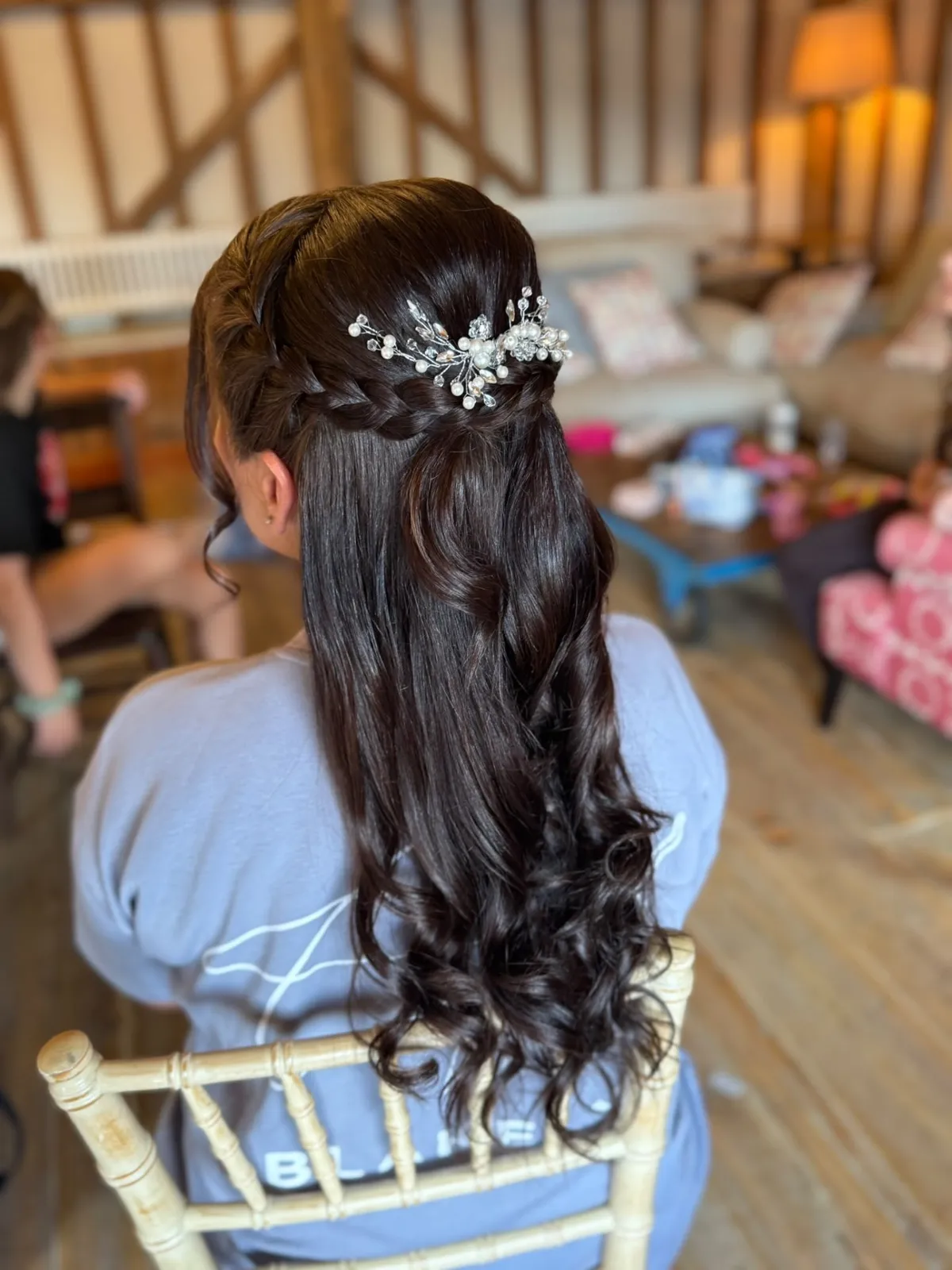 Half-up bridal style with a braid and pearl hair vine by Be Bridal
