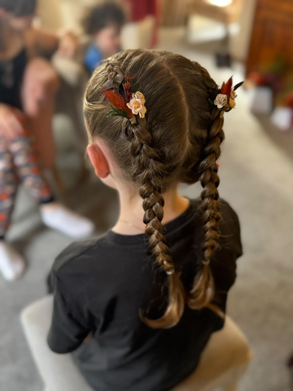 Flower girl's double Dutch braids with autumn floral pins by Be Bridal