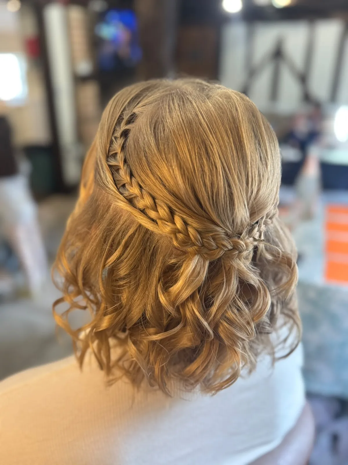 Half-up curls with a delicate fishtail braid crown by Be Bridal