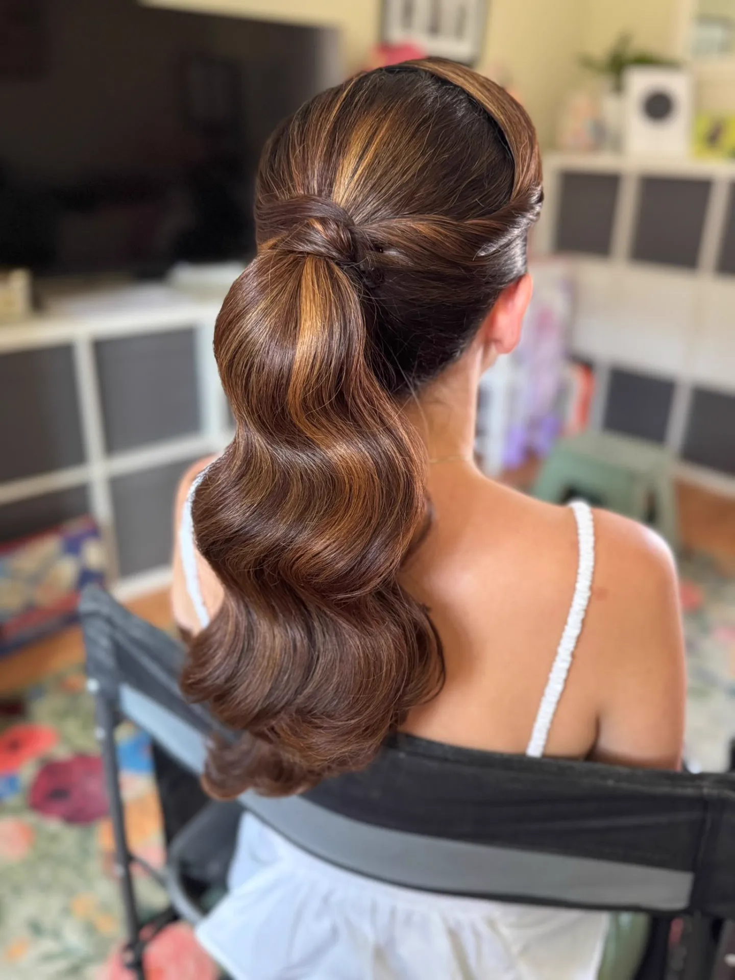 Sleek half-up ponytail with Hollywood waves by Be Bridal