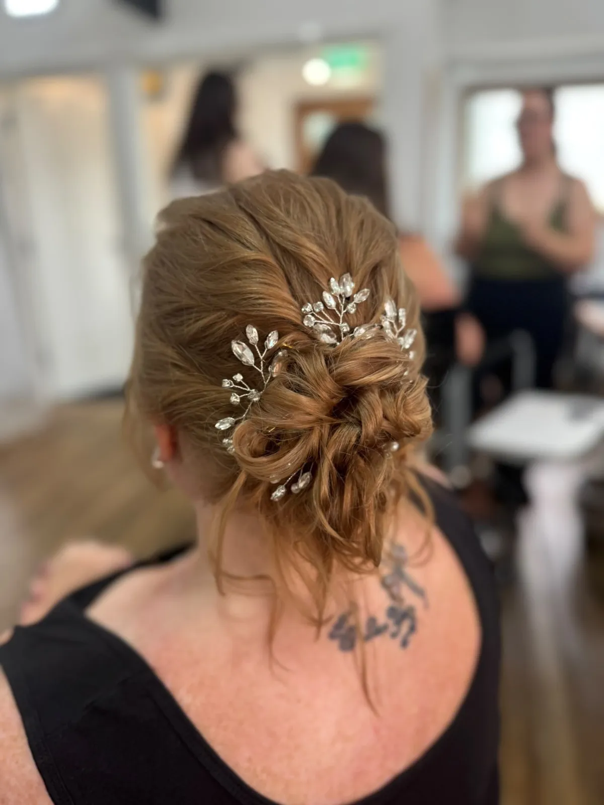Textured red-gold updo with crystal hair vines by Be Bridal
